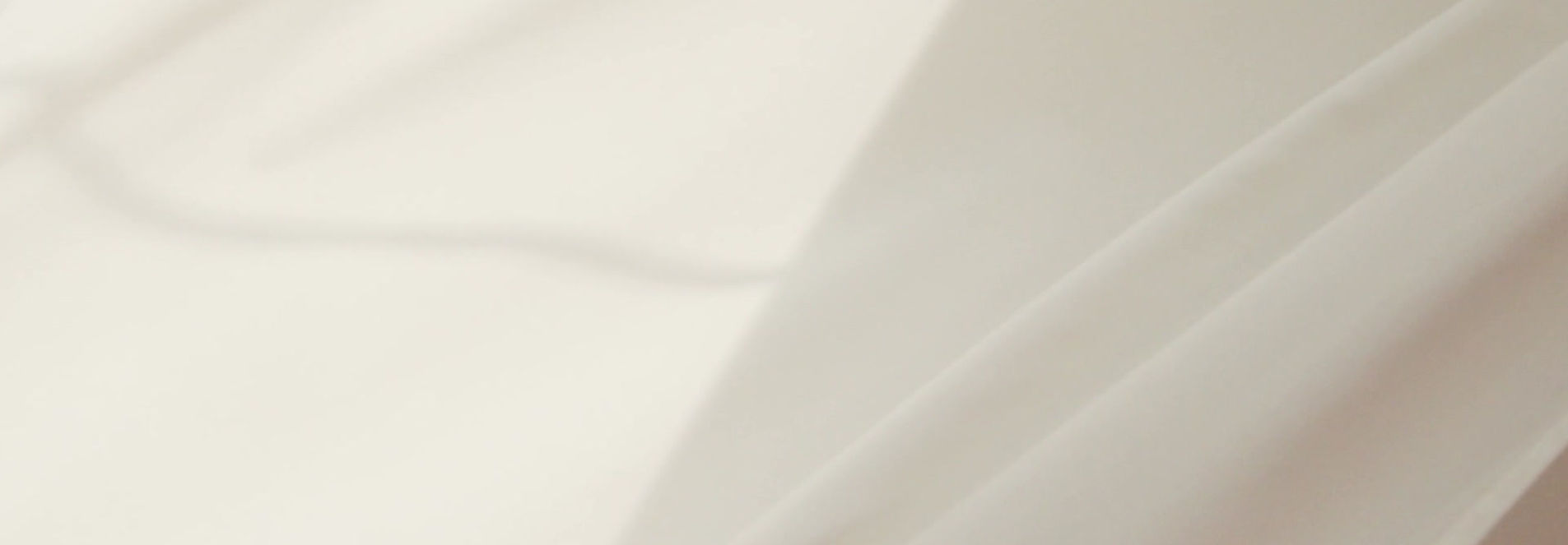 Luxurious hotel bed dressed in crisp white linens
