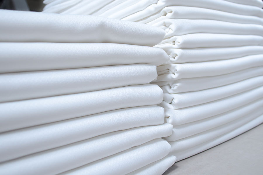Pressed and folded hotel sheets and linens